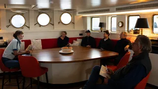 Erik Vonk, owner of <em>Scintilla Maris</em> happily welcomes Dr. Paige Maroni and Tim Macdonald in Akureyri, Iceland