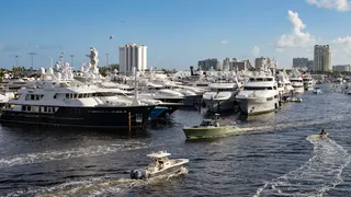 Water taxi transporting guests between FLIBS 2025 show locations