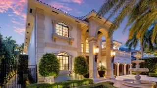 European-inspired waterfront estate at 169 Fiesta Way, Fort Lauderdale with private yacht berth and resort-style pool