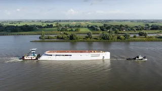 Hull of 83m Feadship project seen for first time on transport to outfitting
