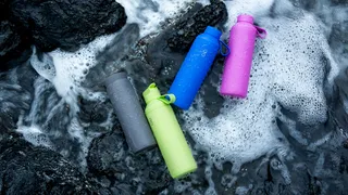 Ocean Bottle reusable water bottle in multiple colours with ocean background