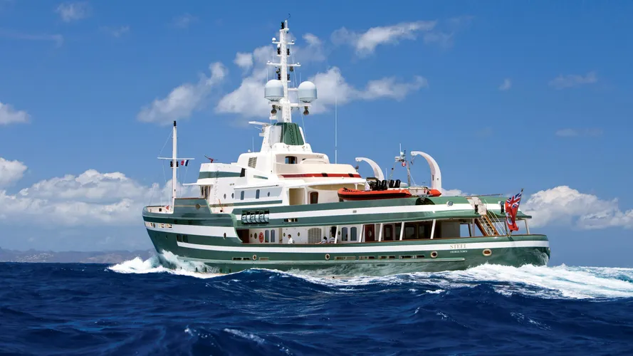 Steel motor yacht running aft