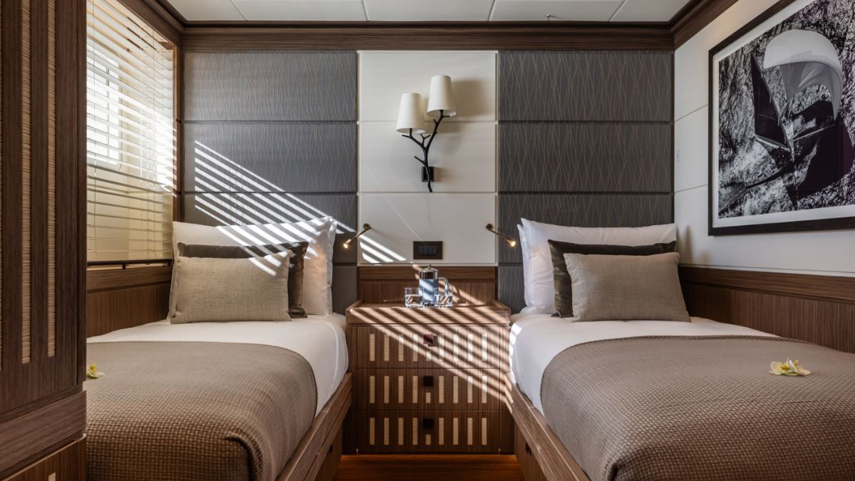 Alice main saloon with panoramic glazing and natural materials